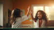 two indian young girls in doctor costumes giving high five
