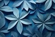 Kaleidoscope of blue paper leaves on a blue background.