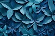 Kaleidoscope of blue paper leaves on a blue background.