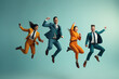 Cheerful diverse business people showing overjoy jumping with raised hands. Different business people jumping on color background. Celebrating success and triumphing victory