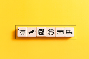 Wooden block with shopping online icon on  for online shopping and e-commerce technology concept.