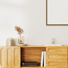 Wall Mural - close up of wooden cupboard with books and decor with corner of an empty frame on white wall, interi