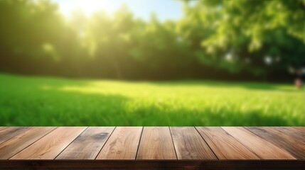 Poster - Wood table top on blurred lawn green background for montage or display your products