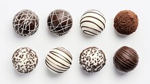 Various Types Of Chocolate Truffles On A White Background Top View. Round Sweets Made Of Milk, Black And White Chocolate On Isolation.