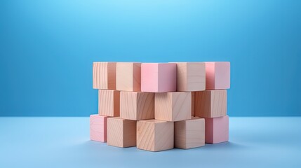 Poster - Breast cancer concept with wooden blocks cubes on blue background. Symbol of breast cancer, fist with strength concept. Healthcare, international women day and world cancer day.