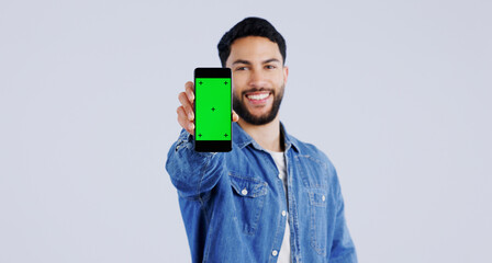Leinwandbilder - Man, smartphone or green screen in portrait with smile, mockup space or happy for advertising. Arab person, phone or face in marketing by tracking markers, mobile app or contact by white background
