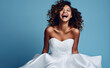 © MD Media - Happy smiling, laughing young curvy, busty women in elegant white wedding dress having fun on isolated plane background