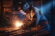 © Naknakhone - Metal welder working with arc welding machine to weld steel at factory.Skillful metal worker working with arc welding.