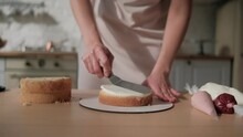 Woman is cooking homemade cake. Pastry chef collects cake from biscuit layers, cake preparation. cooking, baking and cooking, home cooking