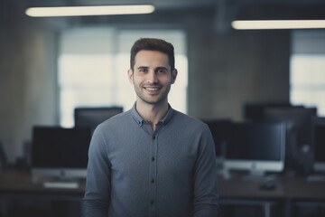 Confident and happy businessman in a modern office, radiating professionalism and success with a cheerful smile.