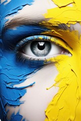Poster - A close-up view of a person's face with vibrant paint. This image can be used for artistic and creative projects.