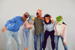 © Studio Romantic - Portrait of group of funny people in animal head masks isolated on grey background. Team of company employees or students having fun together. Entertainment and April Fools day concept.