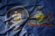 big waving colorful national flag of pennsylvania state and flag of utah state .