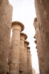 Wall Mural - ancient Egyptian hieroglyphs on massive columns of hippostyle hall in karnak temple in luxor, egypt