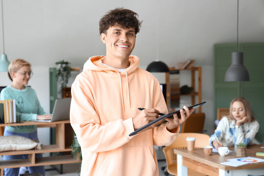 Male graphic designer working with tablet in office
