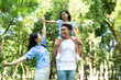 © Timeimage - Photo of young Asian family at park