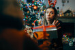 Ungrateful Woman Refusing a Christmas Gift from a Friend. Rude holiday party host rejecting presents from her guests 
