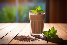 A Healthy Protein Shake Garnished With Mint Leaves Resting On An Old Wooden Table Under Natural Light