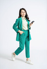 Wall Mural - Image of young Asian business woman on background