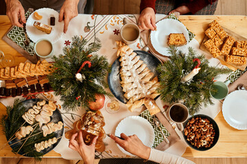 new year, christmas dough dessert in the shape of a christmas tree on a holiday table, christmas tab