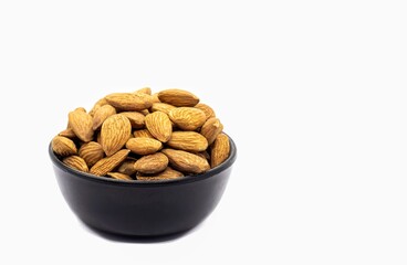 Almond Nut in a Black Bowl Isolated on White Background in Horizontal Orientation with Copy Space, Healthy Eating and Lifestyle Food Concepts