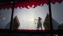 Silhouette Of Wayang Kulit Or Shadow Puppets From Java, Indonesia Puppet Show By Dalang Or Puppeteer