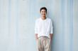 Young japanese man in white shirt and pant.