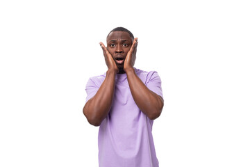 young african man of normal build dressed in a basic light lilac t-shirt with print mockup