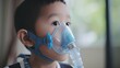 © Creative Station - A close-up view of a young Southeast Asian man using a breathing and respiratory equipment.