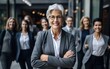 © Kowit - Head shot portrait smiling multiethnic employees group with mature businesswoman executive team leader looking at camera, happy diverse colleagues posing for photo in office, unity and cooperation