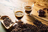 espresso in the glass and raw beans