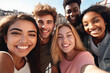 © arhendrix - Multicultural group of young people smiling together at camera - Happy friends taking selfie pic with smartphone outdoors - Life style concept with guys and girls enjoying sunny day
