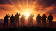 Military silhouettes of soldiers against the backdrop of sunset sky,Silhouette of soldiers,Concept - armed forces.