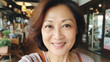 © zayatssv - Closeup selfie portrait of happy smiling senior asian woman indoor