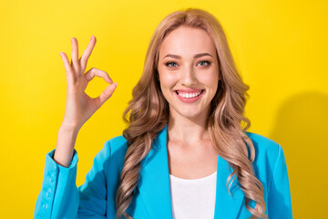 Sticker - Photo of positive gorgeous person beaming smile arm fingers demonstrate okey symbol isolated on yellow color background