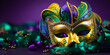 Colorful traditional mardi gras carnival mask with gold, green colors decoration for national festival celebration on purple background with copy space.