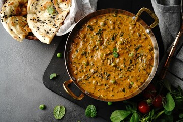 Wall Mural - Homemade Methi Matar Malai -Indian vegetarian curry served with roti, selective focus