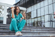 © Dragana Gordic - Upset female nurse. Medical professional looking unhappy. Shot of a young nurse looking stressed out while sitting at stairs in a hospital. Upset female nurse