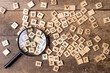 © яна винникова - Magnifying glass with many wood letters of English alphabets, learning English concept