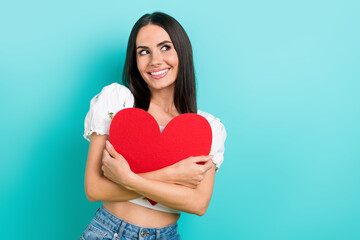 Sticker - Photo of young girlfriend cuddle red heart postcard looking novelty empty space happy valentine day isolated on aquamarine color background