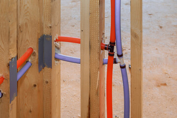 Canvas Print - Pvc plastic red and blue piping water system integration in a new home construction