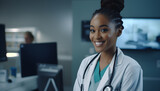 Fototapeta  - Beautiful happy young black doctor in a hospital wearing a coat and stethoscope. Copy space