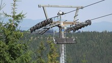 Chairlift, Ski Lift In Alps, Alpine Cable Car, Summer Sports, Off Road  Adventure, Tourists With Mountain Bikes