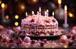 Delicious beautiful birthday cake with pink icing with seven two lit candles