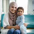 Muslim nurse caring for a child patient.