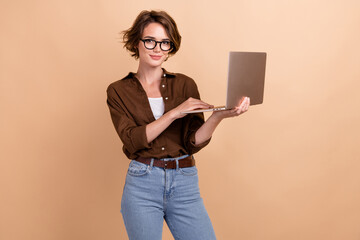 Poster - Photo of cute cheerful lady wear brown shirt communicating apple samsung modern device isolated beige color background