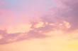 Majestic dusk. Sunset sky twilight in the evening with colorful sunlight. Pastel colors. Abstract nature background. Moody pink, purple and yellow clouds sunset sky.