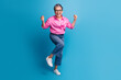 Full size photo of ecstatic overjoyed person wear stylish blouse in eyewear shout yeah win betting isolated on blue color background
