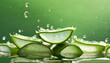 aloe vera slices under water on green background copy space banner