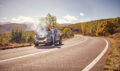 Canvas Print - Man with car problem, standing on the road